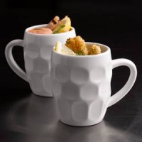 Two White Porcelain Dimples Mugs together with food